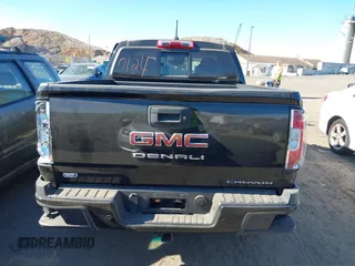 2021 GMC Canyon 4WD Denali z VIN 1GTG6EEN9M1240596, wystawiony jako IAAI lot #40760124 z przebiegiem 52 985 mil mil oraz . Historia ofert i sprzedaży dostępna na DreamBid. Obrazek 16.