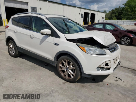 2016 Ford Escape Titanium with VIN 1FMCU9J94GUB31594, listed as a Copart auction lot 51690565 with 119,699 mi miles and Salvage Title. Bid and sale history available at DreamBid. Image 4.