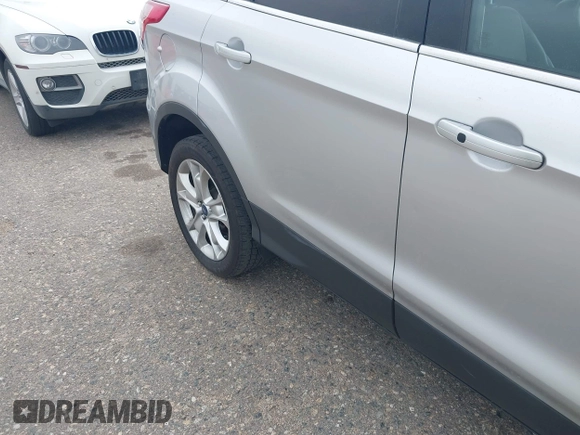 2016 Ford Escape Titanium with VIN 1FMCU9JX3GUC86930, listed as a IAAI auction lot 42582263 with 113,386 mi miles and . Bid and sale history available at DreamBid. Image 6.