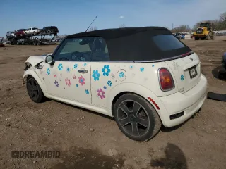 2010 MINI Convertible S with VIN WMWMS3C51ATZ85166, listed as a Copart auction lot 52907775 with 90,090 mi miles and Salvage title. Bid and sale history available at DreamBid. Image 2.