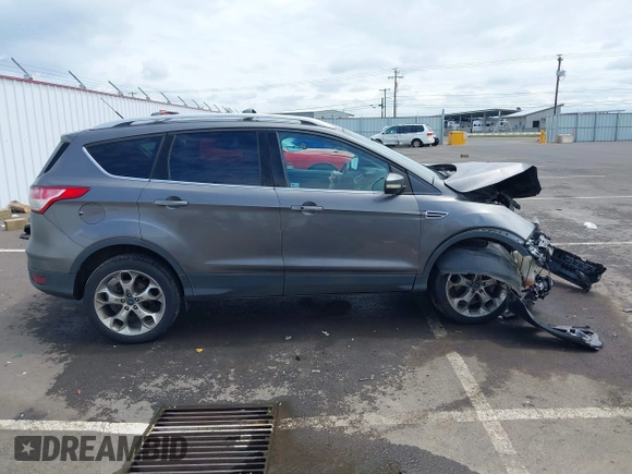 2013 Ford Escape Titanium with VIN 1FMCU9J95DUC95061, listed as a IAAI auction lot 42293047 with 124,641 mi miles and . Bid and sale history available at DreamBid. Image 14.