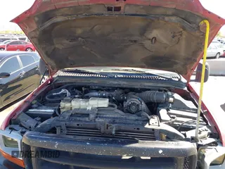 1999 Ford Super Duty F-250 XL with VIN 1FTNW21F7XED02157, listed as a IAAI auction lot 41866004 with 419,660 mi miles. Bid and sale history available at carsss.com. Image 10.