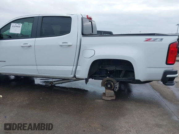 2019 Chevrolet Colorado 4WD Z71 z VIN 1GCGTDEN3K1317883, wystawiony jako IAAI lot #41439010 z przebiegiem 34 306 mil mil oraz . Historia ofert i sprzedaży dostępna na DreamBid. Obrazek 18.