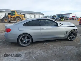 2015 BMW 4 Series 428i xDrive with VIN WBA3N9C53FK247985, listed as a IAAI auction lot 41395534 with 76,856 mi miles and . Bid and sale history available at DreamBid. Image 13.