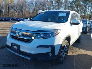 2022 Honda Pilot EX-L with VIN 5FNYF6H54NB084899, listed as a IAAI auction lot 41524725 with 35,827 mi miles. Bid and sale history available at carsss.com. Image 2.