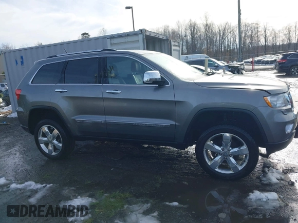 2013 Jeep Grand Cherokee Overland with VIN 1C4RJFCG8DC581719, listed as a IAAI auction lot 41566666 with 152,332 mi miles. Bid and sale history available at carsss.com. Image 13.