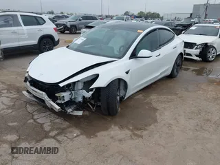 2021 Tesla Model 3 Long Range with VIN 5YJ3E1EB3MF059713, listed as a IAAI auction lot 41778289 with 52,211 mi miles. Bid and sale history available at carsss.com. Image 2.