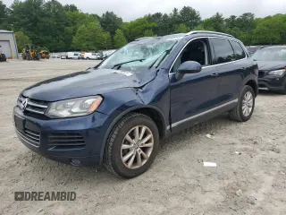 2014 Volkswagen Touareg Sport with VIN WVGEF9BP4ED012330, listed as a Copart auction lot 58896205 with 94,965 mi miles and Clean title. Bid and sale history available at DreamBid. Image 1.