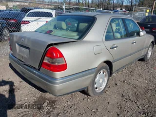 1997 Mercedes-Benz C with VIN WDBHA23E6VF506602, listed as a IAAI auction lot 42042704 with Not provided miles and . Bid and sale history available at DreamBid. Image 4.