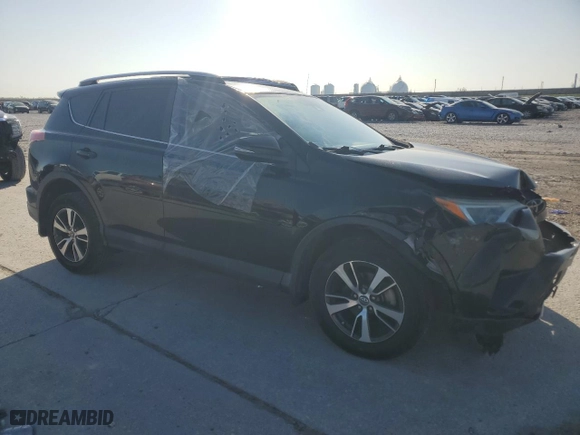 2018 Toyota RAV4 XLE with VIN 2T3WFREV2JW472232, listed as a Copart auction lot 52464025 with 131,421 mi miles and Salvage Title. Bid and sale history available at carsss.com. Image 4.