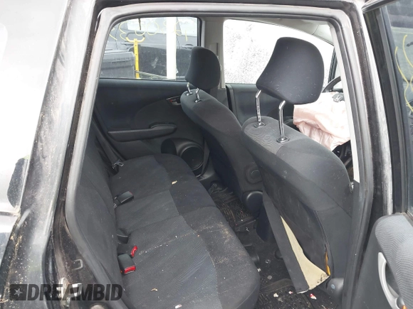 2009 Honda Fit Sport with VIN JHMGE88469S055316, listed as a IAAI auction lot 42306333 with 144,377 mi miles and . Bid and sale history available at DreamBid. Image 8.