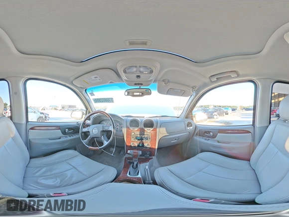 2006 GMC Envoy Denali with VIN 1GKET63M662228794, listed as a Copart auction lot 70802804 with 134,323 mi miles and Salvage Title. Bid and sale history available at DreamBid. Image 14.