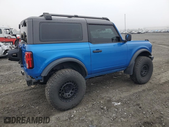 2023 Ford Bronco with VIN 1FMDE5AHXPLB26651, listed as a Copart auction lot 77497964 with 19,700 mi miles and Salvage Title. Bid and sale history available at carsss.com. Image 3.