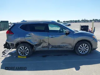 2017 Nissan Rogue SV with VIN KNMAT2MT9HP581822, listed as a IAAI auction lot 42140794 with 74,261 mi miles. Bid and sale history available at carsss.com. Image 13.