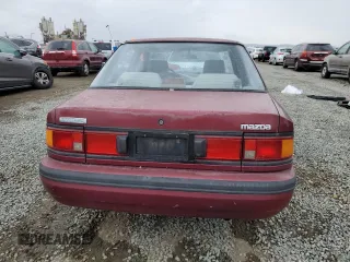 1990 Mazda Protege z VIN JM1BG2246L0167483, wystawiony jako Copart lot #48603295 z przebiegiem 170 461 mil mil oraz Czysty tytuł • Clean title. Historia ofert i sprzedaży dostępna na DreamBid. Obrazek 6.