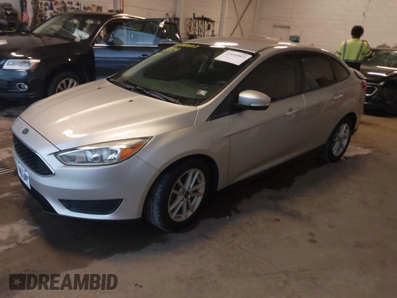 2016 Ford Focus SE z VIN 1FADP3F24GL393913, wystawiony jako IAAI lot #42640803 z przebiegiem 89 547 mil mil oraz . Historia ofert i sprzedaży dostępna na DreamBid. Obrazek 2.