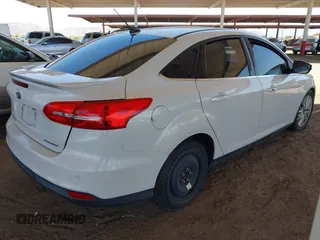2015 Ford Focus Titanium with VIN 1FADP3J28FL256155, listed as a IAAI auction lot 42350610 with 53,840 mi miles and . Bid and sale history available at DreamBid. Image 4.