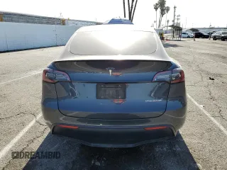 2022 Tesla Model Y Performance z VIN 7SAYGDEF1NF405329, wystawiony jako Copart lot #57249195 z przebiegiem 62 423 mil mil oraz Szkoda całkowita • Salvage title. Historia ofert i sprzedaży dostępna na DreamBid. Obrazek 6.
