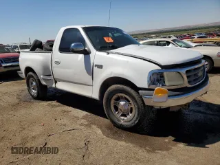 2000 Ford F-150 XL with VIN 1FTZF0727YKA84301, listed as a Copart auction lot 71593544 with 0 mi miles and Salvage Title. Bid and sale history available at carsss.com. Image 4.