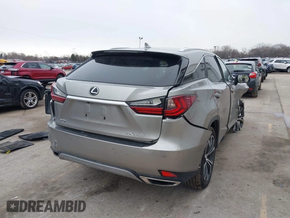 2021 Lexus RX with VIN 2T2HZMDA4MC305057, listed as a IAAI auction lot 41706486 with 37,518 mi miles. Bid and sale history available at carsss.com. Image 4.