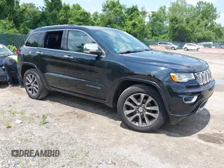 2017 Jeep Grand Cherokee Overland with VIN 1C4RJFCG7HC843414, listed as a IAAI auction lot 42394139 with 103,061 mi miles and . Bid and sale history available at DreamBid. Image 1.