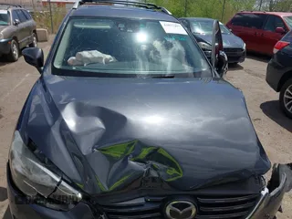 2016 Mazda CX-5 Grand Touring with VIN JM3KE4DY7G0643643, listed as a IAAI auction lot 42077497 with 120,343 mi miles and . Bid and sale history available at carsss.com. Image 10.
