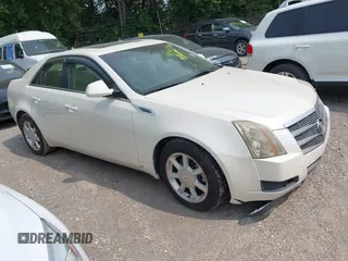 2009 Cadillac CTS AWD z VIN 1G6DG577590133737, wystawiony jako IAAI lot #42457306 z przebiegiem 106 185 mil mil oraz . Historia ofert i sprzedaży dostępna na DreamBid. Obrazek 1.