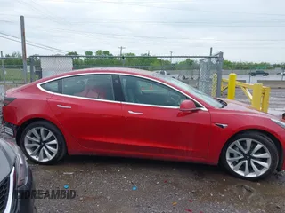 2018 Tesla Model 3 Long Range Battery with VIN 5YJ3E1EA6JF052659, listed as a IAAI auction lot 42093903 with 49,255 mi miles and . Bid and sale history available at DreamBid. Image 14.