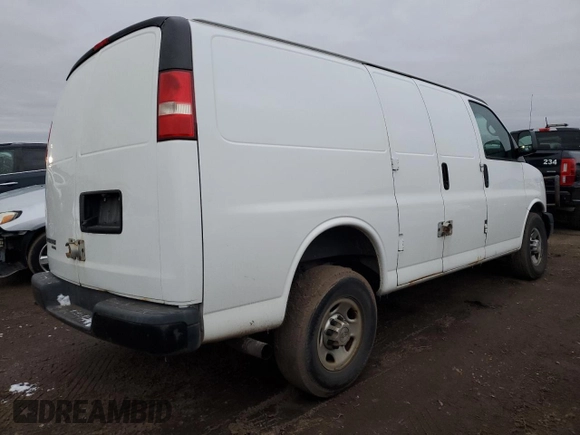 2014 Chevrolet Express Cargo Van with VIN 1GCWGFBA5E1130260, listed as a Copart auction lot 85303264 with 181,622 mi miles and Salvage Title. Bid and sale history available at carsss.com. Image 3.