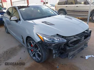 2020 Kia Stinger GT2 with VIN KNAE55LC1L6075699, listed as a IAAI auction lot 41598898 with 58,894 mi miles. Bid and sale history available at carsss.com. Image 1.