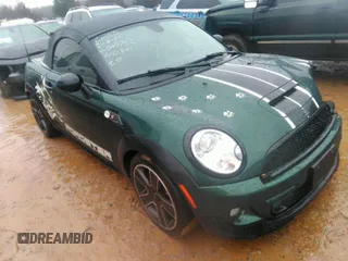 2013 MINI Roadster S with VIN WMWSY3C51DT565742, listed as a IAAI auction lot 41571563 with 99,700 mi miles and . Bid and sale history available at DreamBid. Image 1.