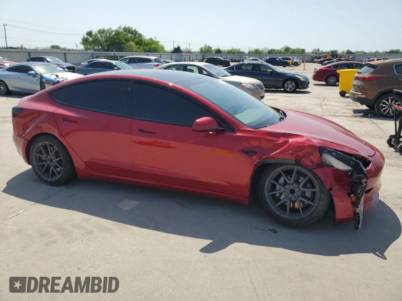 2021 Tesla Model 3 Standard Range Plus with VIN 5YJ3E1EA7MF915053, listed as a Copart auction lot 51172815 with 69,303 mi miles and Salvage Title. Bid and sale history available at DreamBid. Image 4.