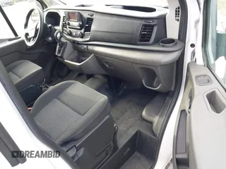 2021 Ford Transit Cargo with VIN 1FTBR1Y85MKA69355, listed as a IAAI auction lot 42544780 with 33,288 mi miles and . Bid and sale history available at DreamBid. Image 5.