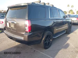 2015 GMC Yukon Denali z VIN 1GKS1CKJ7FR566419, wystawiony jako IAAI lot #41948825 z przebiegiem 235 037 mil mil oraz . Historia ofert i sprzedaży dostępna na DreamBid. Obrazek 4.