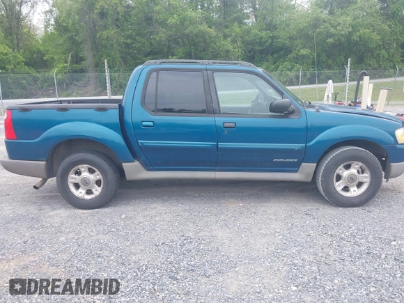 2001 Ford Explorer Sport Trac z VIN 1FMZU77E11UC71161, wystawiony jako IAAI lot #42184342 z przebiegiem 196 240 mil mil oraz . Historia ofert i sprzedaży dostępna na DreamBid. Obrazek 13.