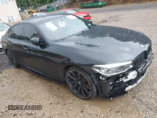 2018 BMW 5 Series M550i xDrive with VIN WBAJB9C5XJB286923, listed as a IAAI auction lot 42527301 with 76,923 mi miles and . Bid and sale history available at DreamBid. Image 1.