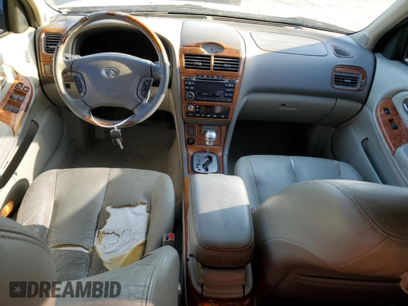 2002 Infiniti I35 Luxury z VIN JNKDA31A12T025612, wystawiony jako Copart lot #71493464 z przebiegiem 80 210 mil mil oraz Szkody całkowita. Historia ofert i sprzedaży dostępna na DreamBid. Obrazek 8.