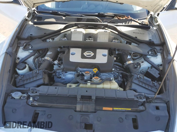 2014 Nissan 370Z Touring with VIN JN1AZ4EH1EM635411, listed as a Copart auction lot 82670344 with 77,501 mi miles and Salvage Title. Bid and sale history available at carsss.com. Image 11.