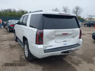 2016 GMC Yukon SLT with VIN 1GKS2BKC5GR374815, listed as a IAAI auction lot 41889495 with 163,464 mi miles. Bid and sale history available at carsss.com. Image 3.
