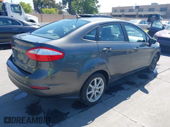 2019 Ford Fiesta SE z VIN 3FADP4BJ2KM131012, wystawiony jako IAAI lot #42228822 z przebiegiem 100 460 mil mil oraz . Historia ofert i sprzedaży dostępna na DreamBid. Obrazek 4.