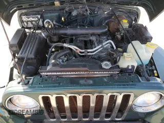 2000 Jeep Wrangler Sahara z VIN 1J4FA59S1YP746043, wystawiony jako Copart lot #58842665 z przebiegiem 148 348 mil mil oraz Szkoda całkowita • Salvage title. Historia ofert i sprzedaży dostępna na DreamBid. Obrazek 11.