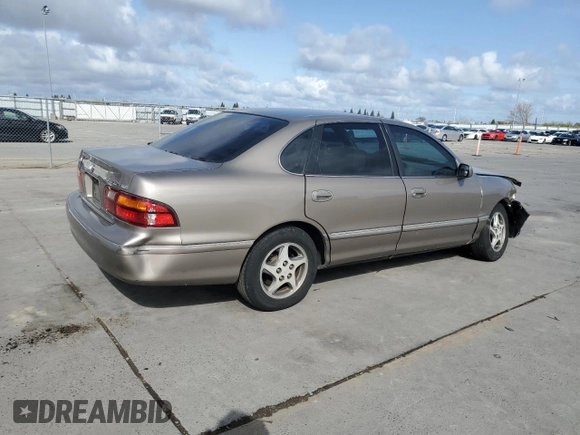 1998 Toyota Avalon XL with VIN 4T1BF18B1WU255028, listed as a Copart auction lot 51017075 with 248,911 mi miles and Salvage Title. Bid and sale history available at DreamBid. Image 3.