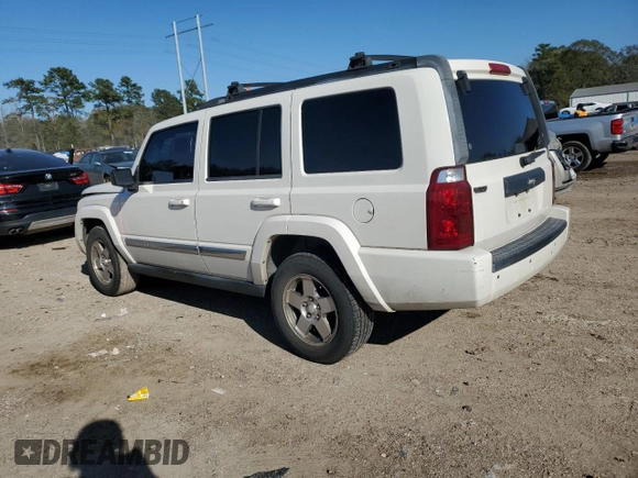 2010 Jeep Commander Sport with VIN 1J4RH4GK9AC113888, listed as a Copart auction lot 84553544 with 208,109 mi miles and Salvage title. Bid and sale history available at DreamBid. Image 2.