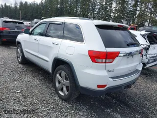 2013 Jeep Grand Cherokee Limited with VIN 1C4RJFBT0DC619216, listed as a IAAI auction lot 41703137 with 142,577 mi miles. Bid and sale history available at carsss.com. Image 3.