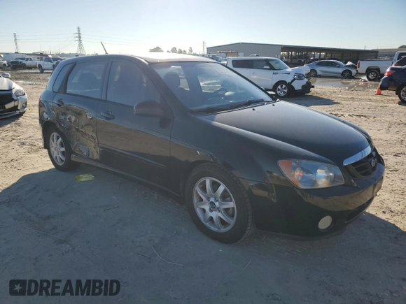 2005 Kia Spectra with VIN KNAFE161355073968, listed as a Copart auction lot 84543784 with 166,858 mi miles and Salvage Title. Bid and sale history available at carsss.com. Image 4.