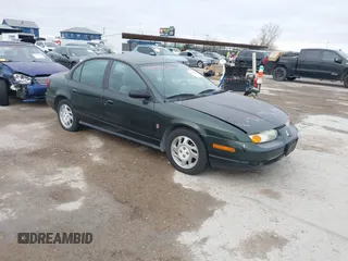2000 Saturn SL z VIN 1G8ZK5276YZ210810, wystawiony jako IAAI lot #41418014 z przebiegiem 93 078 mil mil oraz . Historia ofert i sprzedaży dostępna na DreamBid. Obrazek 1.