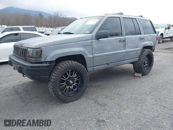 1995 Jeep Grand Cherokee Laredo with VIN 1J4GZ58S4SC778322, listed as a IAAI auction lot 41498800 with 255,058 mi miles. Bid and sale history available at carsss.com. Image 2.