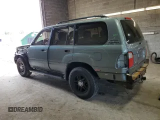2001 Lexus LX 470 z VIN JTJHT00W113505721, wystawiony jako Copart lot #56463665 z przebiegiem 223 553 mil mil oraz Szkody całkowita. Historia ofert i sprzedaży dostępna na DreamBid. Obrazek 2.