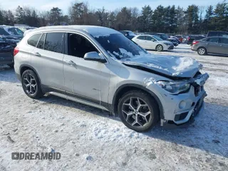 2017 BMW X1 xDrive28i with VIN WBXHT3Z34H4A54128, listed as a IAAI auction lot 41382063 with 124,391 mi miles. Bid and sale history available at carsss.com. Image 1.