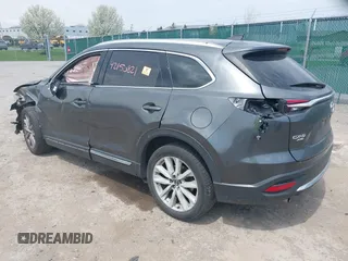 2016 Mazda CX-9 Grand Touring with VIN JM3TCBDY3G0117802, listed as a IAAI auction lot 42150821 with 157,760 mi miles and . Bid and sale history available at DreamBid. Image 3.